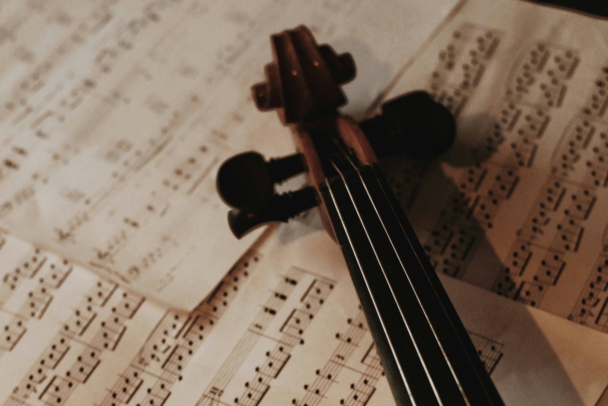 Violin resting on sheet music