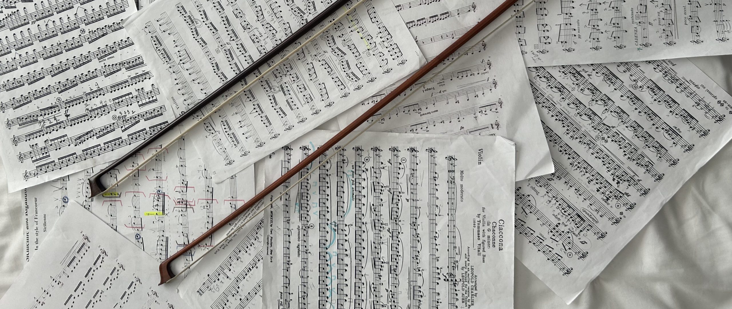 violin bows on sheet music